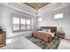 Spacious main bedroom with large window, wood headboard, and stylish decor at 16298 Grand Cypress Dr, Noblesville, IN 46060