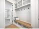 Functional mudroom with built-in bench, cubbies and coat hooks at 16298 Grand Cypress Dr, Noblesville, IN 46060