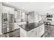 Large kitchen island with granite countertop and white cabinetry at 16563 Maines Valley Dr, Noblesville, IN 46062