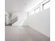 Finished basement with large windows and stairs at 17366 Newton Main St, Westfield, IN 46074