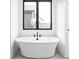 Free-standing bathtub with a large window at 17366 Newton Main St, Westfield, IN 46074