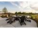 Relaxing fire pit area with Adirondack chairs near pond at 17366 Newton Main St, Westfield, IN 46074