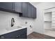Laundry room with cabinetry and a utility sink at 17366 Newton Main St, Westfield, IN 46074