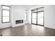 Living room features a modern fireplace, hardwood floors, and large windows at 17366 Newton Main St, Westfield, IN 46074