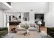 Open living space with a view into the kitchen and a cozy seating area at 5187 Abington Way, Zionsville, IN 46077
