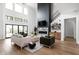 Spacious living room with a large fireplace, high ceilings, and lots of natural light at 5187 Abington Way, Zionsville, IN 46077