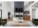 Living room featuring a statement fireplace and built-in shelving at 5187 Abington Way, Zionsville, IN 46077