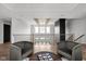 Open loft area with two armchairs and a view of the living room below at 5187 Abington Way, Zionsville, IN 46077