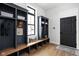 Functional mudroom with built-in bench seating and storage at 5187 Abington Way, Zionsville, IN 46077