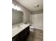 Bathroom with a single vanity, bathtub, and white tile at 2834 Maricopa Blvd, Whitestown, IN 46075