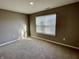 Bright bedroom with neutral walls, carpet, and window blinds at 2834 Maricopa Blvd, Whitestown, IN 46075