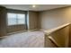 Upstairs bedroom with carpet flooring and window with blinds at 2834 Maricopa Blvd, Whitestown, IN 46075