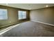 Well-lit bedroom with neutral walls, carpet, and window blinds at 2834 Maricopa Blvd, Whitestown, IN 46075