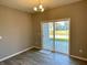 Dining area with sliding glass door leading to backyard at 2834 Maricopa Blvd, Whitestown, IN 46075