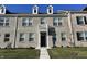 Brick townhouse exterior with a balcony and a neatly landscaped lawn at 2834 Maricopa Blvd, Whitestown, IN 46075
