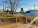 Wooden deck overlooking a backyard with shed and street view at 3415 Oak Tree S Dr, Indianapolis, IN 46227