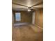 Spacious bedroom with ceiling fan and window at 5283 Tufton Dr, Indianapolis, IN 46254