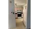 Kitchen with light-colored cabinets, black countertops and appliances at 5283 Tufton Dr, Indianapolis, IN 46254