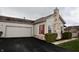 Attached garage with white door and driveway at 5817 Cool Hollow Way, Indianapolis, IN 46237