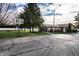 Community basketball court with goal and ample green space at 8016 Minlo Dr, Indianapolis, IN 46227