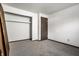 Bedroom with neutral walls, carpet, and closet at 8016 Minlo Dr, Indianapolis, IN 46227