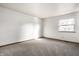 Simple bedroom with carpet and a window at 8016 Minlo Dr, Indianapolis, IN 46227