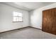 Spacious bedroom with carpet and large closet at 8016 Minlo Dr, Indianapolis, IN 46227