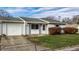 Ranch home with attached garage and driveway at 8016 Minlo Dr, Indianapolis, IN 46227