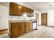 View of kitchen with wood cabinets and a dishwasher at 8016 Minlo Dr, Indianapolis, IN 46227