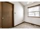 Cozy kitchen with tile flooring and a window overlooking the backyard at 8016 Minlo Dr, Indianapolis, IN 46227