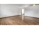 Bright living room with hardwood floors and access to other rooms at 8016 Minlo Dr, Indianapolis, IN 46227