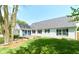 White house exterior with gray roof, deck, and a well-maintained lawn at 103 Lake Vista Dr, Fishers, IN 46038