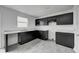 Modern kitchen featuring dark cabinets and marble countertops at 1126 Lona Dr, Martinsville, IN 46151