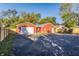 Spacious backyard with two red garages and a wooden fence at 1467 S Illinois St, Indianapolis, IN 46225