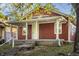 Charming red house with front porch and landscaped yard at 1467 S Illinois St, Indianapolis, IN 46225