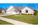 Two-unit brick building with attached garages and manicured lawn at 148 Bay Ridge Dr, Pendleton, IN 46064