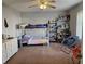 ' bedroom with bunk beds, a dresser, storage shelves, and a sitting area at 1517 N E St, Elwood, IN 46036