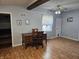 Home office or den with a wooden desk, chair, and wood-look flooring at 1517 N E St, Elwood, IN 46036
