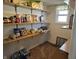 Well-stocked pantry with ample shelving for food and household items at 1517 N E St, Elwood, IN 46036