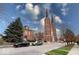 Brick church with twin steeples and landscaping at 1626 S Delaware St, Indianapolis, IN 46225