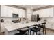 Modern kitchen with white cabinets, stainless steel appliances, and an island at 17259 Carlton Rd, Westfield, IN 46074