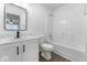 Bright bathroom with white fixtures, wood-look flooring, and a bathtub/shower combo at 1939 Archbury Dr, Avon, IN 46123