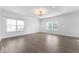 Bright living room with large windows, wood floors, and recessed lighting at 1939 Archbury Dr, Avon, IN 46123