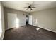 Spacious bedroom with neutral walls and dark carpet at 258 E Pennsylvania St, Shelbyville, IN 46176