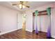 Cozy bedroom with hardwood floors, ceiling fan and walk-in closet at 29219 N State Road 19 N, Atlanta, IN 46031