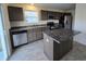 Modern kitchen with dark brown cabinets and stainless steel appliances at 3117 Lennon Ln, Indianapolis, IN 46235