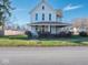 Two-story house with front porch and landscaped yard at 390 N Graham St, Martinsville, IN 46151