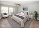 Main bedroom with large windows, ceiling fan and neutral decor at 3965 N Meridian St # Apt 2A, Indianapolis, IN 46208
