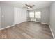 Bedroom with large closet and wood-look floors at 3965 N Meridian St # Apt 2A, Indianapolis, IN 46208