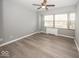 Spacious bedroom with large windows and ceiling fan at 3965 N Meridian St # Apt 2A, Indianapolis, IN 46208